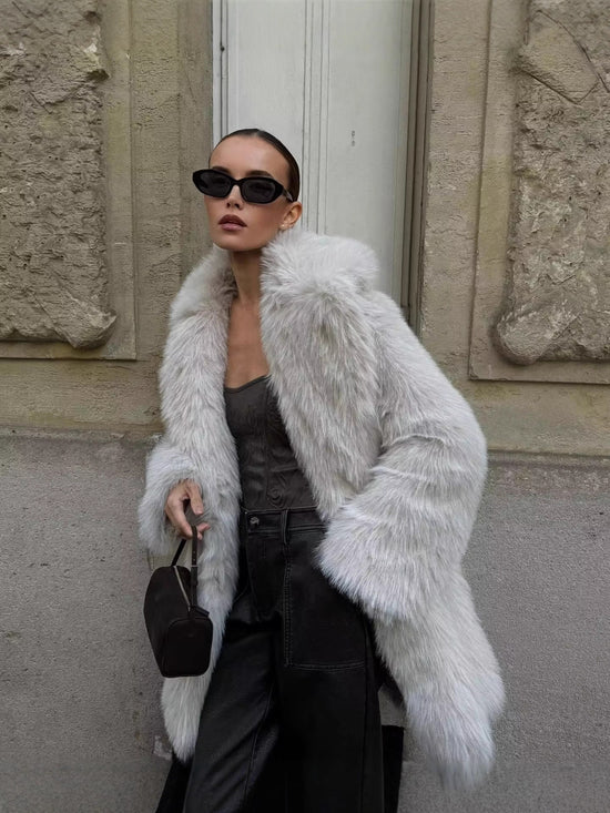 Manteau élégant en fausse fourrure